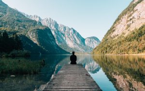 Image of person sitting in silence in nature